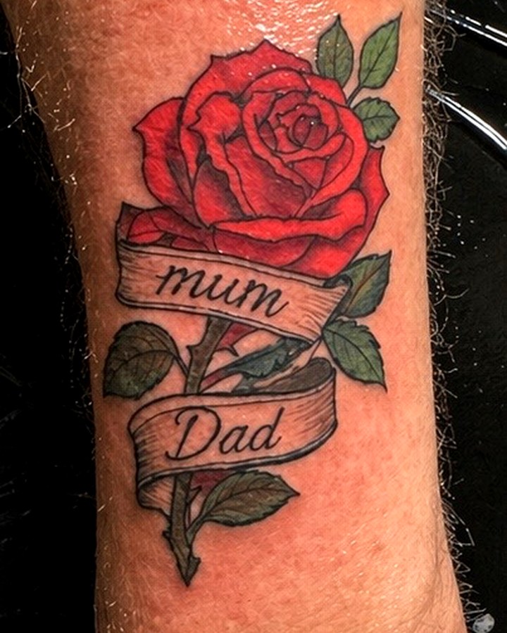 Red rose tattoo with mum and dad ribbon